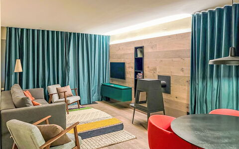 Casa Partnun 4-3: Furniture, Interior Design, Flooring, Wood, Floor, Textile, Room, Ceiling, Lighting, Table