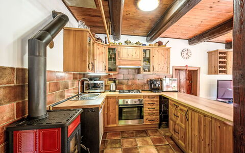 U Tří Medvědů: Kitchen, Wood, Furniture, Interior Design, Countertop, Flooring, Ceiling, Major Appliance, Kitchen Appliance, Cabinetry