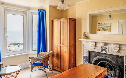Smugglers View: Interior Design, Furniture, Floor, Sea, Ocean, Wood Stain, Hardwood, Varnish, Chair, Curtain