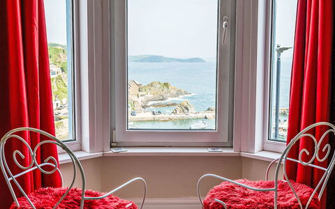 Smugglers View: Red, Furniture, Interior Design, Room, Curtain, Window Treatment, Window Covering, Chair, Daylighting, Linens