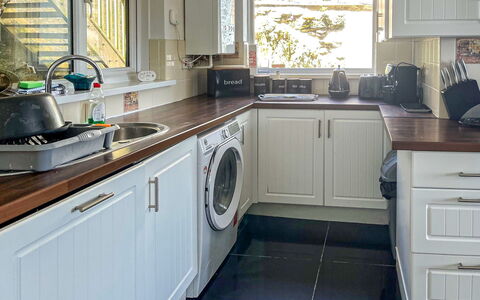 Smugglers View: Kitchen Appliance, Kitchen, Countertop, Interior Design, Major Appliance, Flooring, Cabinetry, Wood, Home Appliance, Floor