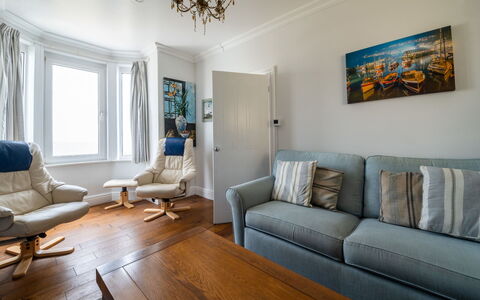 Smugglers View: Furniture, Interior Design, Flooring, Couch, Floor, Wood, Room, Living Room, Ceiling, Apartment