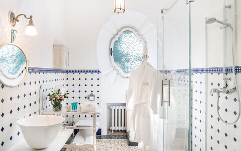 Flor Grand Lake Villa: Blue, Plumbing Fixture, Interior Design, Bathroom, Plumbing, Tap, Tile, Sink, Light Fixture, Porcelain