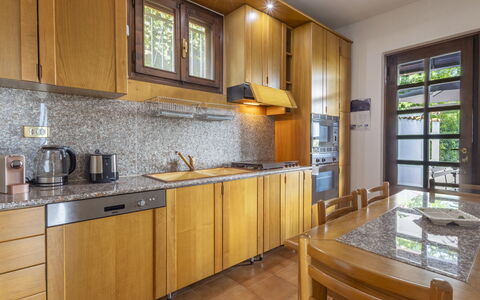 Ortigara Terrace View: Kitchen, Wood, Countertop, Interior Design, Flooring, Cabinetry, Kitchen Appliance, Floor, Major Appliance, Room