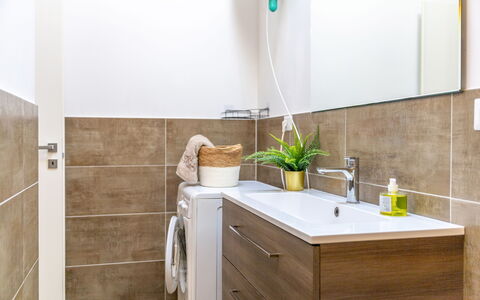 Seaside Apartment: Flooring, Plumbing Fixture, Interior Design, Bathroom Cabinet, Floor, Bathroom, Sink, Tap, Plumbing, Home