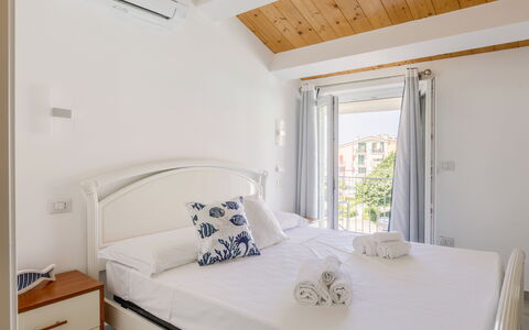 Seaside Apartment: Apartment, Home, Resort, Chair, Hotel, Balcony, Villa, Houseplant, Outdoor Furniture, Penthouse Apartment