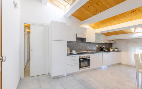 Seaside Apartment: Interior Design, Flooring, Ceiling, Wood, Floor, Furniture, Room, Countertop, Kitchen, Apartment