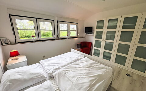 Friesenwohnung: Bedroom, Bed, Interior Design, Flooring, Floor, Furniture, Ceiling, Room, Bed Sheet, Bedding