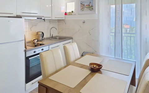 Emma: Furniture, Interior Design, Flooring, Floor, Wood, Room, Table, Kitchen Appliance, Kitchen, Kitchen & Dining Room Table