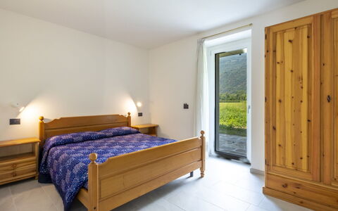 Isola Verde Garden Home: Interior Design, Flooring, Room, Ceiling, Floor, Furniture, Hardwood, Apartment, Wood Stain, Bed
