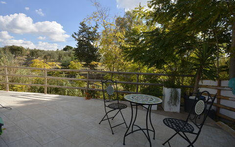 La Dimora di Artemide: Furniture, Outdoor Furniture, Chair, Fence, Handrail, Shade, Outdoor Table, Balcony, Landscaping, Deck