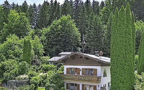 Velden am Wörthersee 39: Tree, House, Shrub, Home, Roof, Cottage, Garden, Larch, Estate, Landscaping