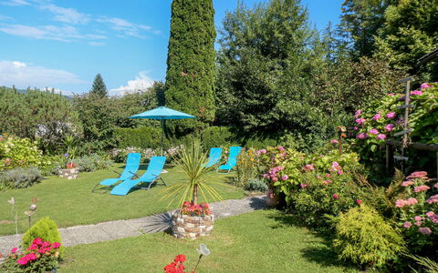 Velden am Wörthersee 39: Blue, Flower, Shrub, Garden, Groundcover, Landscaping, Lawn, Yard, Backyard