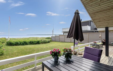 Wiebke - 50M from the Sea: Porch, Deck, Shade, Hardwood, Plank, Chair, Design, Wood Flooring, Outdoor Furniture, Walkway