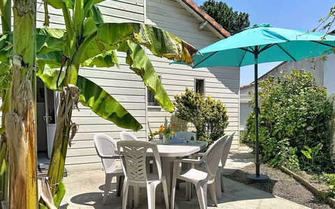 L'Estuaire: Umbrella, Furniture, Outdoor Furniture, Chair, Shade, Outdoor Table, Garden, Eco Hotel, Backyard, Yard