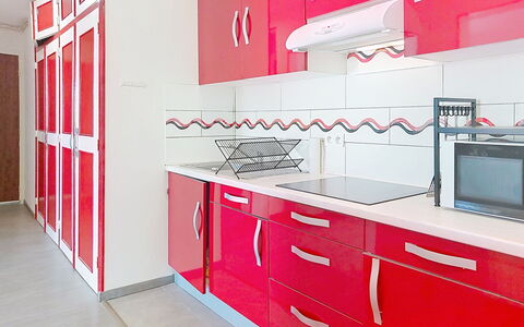 Les Dunes: Red, Flooring, Interior Design, Floor, Major Appliance, Kitchen, Home, Furniture, Room, Cabinetry