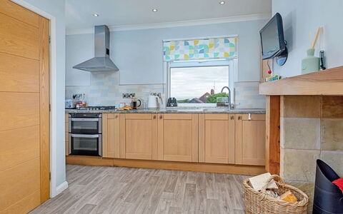 Shoe Buttons Cottage at Gap Road: Flooring, Kitchen, Interior Design, Furniture, Floor, Countertop, Kitchen Appliance, Wood, Major Appliance, Cabinetry