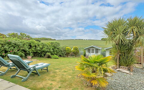 Shoe Buttons Cottage at Gap Road: Shrub, Garden, Cottage, Lawn, Landscaping, Yard, Estate, Eco Hotel, Backyard, Resort