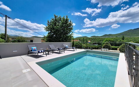 Sunce: Swimming Pool, Composite Material, Resort, Eco Hotel, Outdoor Furniture, Mountain Range, Tile, Shade, Water Feature, Design