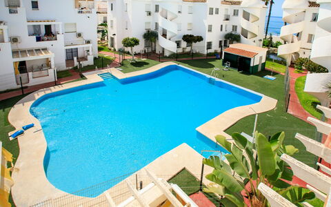 Laguna Beach Padel: Wood, Furniture, Chair, Sea, Apartment, Balcony, Ocean, Shade, Outdoor Furniture, Wood Stain
