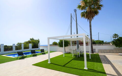 El Lloveret: Wood, Furniture, Chair, Sea, Apartment, Balcony, Ocean, Shade, Outdoor Furniture, Wood Stain