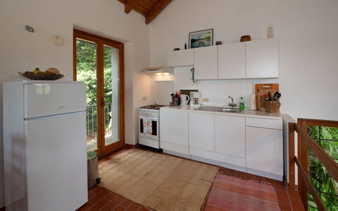 Malpaga: Flooring, Interior Design, Wood, Kitchen, Furniture, Floor, Kitchen Appliance, Countertop, Ceiling, Major Appliance