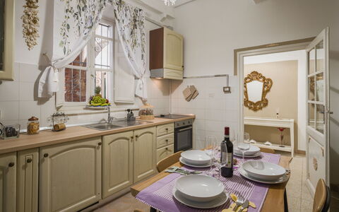 Nido nel Centro: Furniture, Interior Design, Wood, Flooring, Cabinetry, Room, Kitchen, Ceiling, Lighting, Floor
