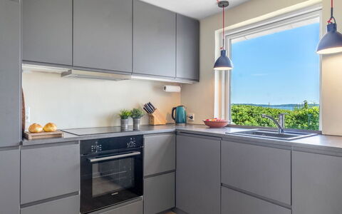 Alkmund - 100M from the Sea: Kitchen, Kitchen Appliance, Cabinetry, Countertop, Major Appliance, Interior Design, Flooring, Wood, Home Appliance, Kitchen Stove