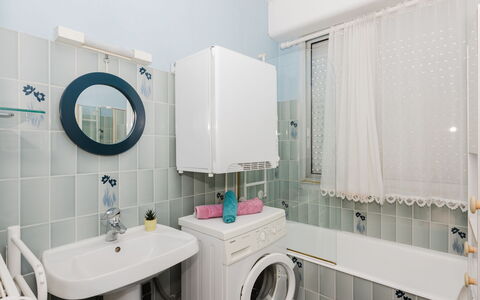 Le Clémenceau: Interior Design, Plumbing Fixture, Flooring, Washing Machine, Bathroom, Floor, Sink, Bathroom Cabinet, Ceiling, Laundry Room