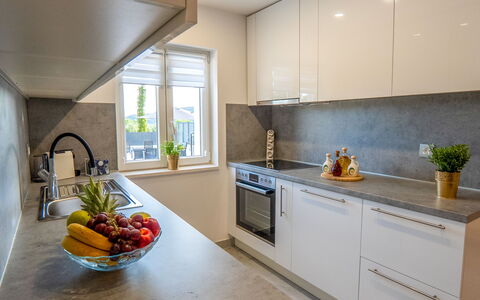 Lili: Countertop, Kitchen, Kitchen Appliance, Interior Design, Major Appliance, Flooring, Cabinetry, Home Appliance, Furniture, Wood