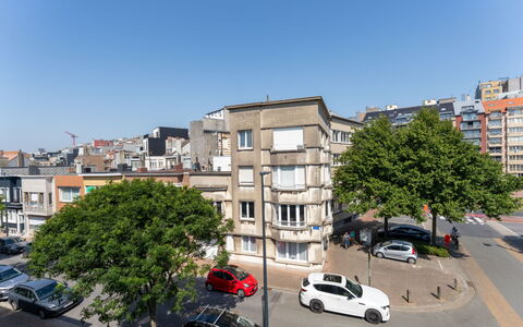 Centrally Located The Corner: Sky, Building, Window, City, Urban Area, Residential Area, Apartment, Car, Neighbourhood, Town