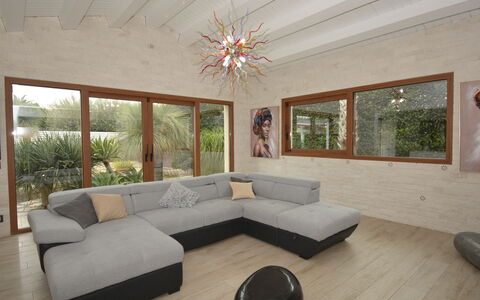 Villa Monaco: Furniture, Couch, Interior Design, Living Room, Flooring, Floor, Home, Apartment, Coffee Table