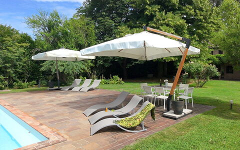 Villa Dorina: Umbrella, Outdoor Furniture, Furniture, Shade, Chair, Sunlounger, Swimming Pool, Garden, Resort, Outdoor Table