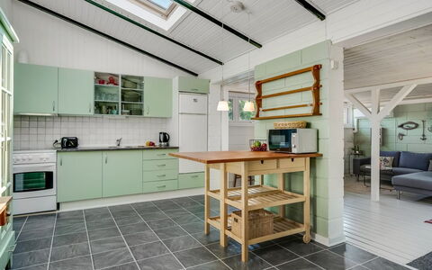 Milo - 200M to the Fjord: Flooring, Ceiling, Interior Design, Kitchen, Floor, Furniture, Major Appliance, Cabinetry, Room, Light Fixture