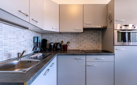 Duinenzicht with Balcony: Countertop, Kitchen, Kitchen Appliance, Cabinetry, Kitchen Sink, Major Appliance, Sink, Plumbing Fixture, Interior Design, Flooring
