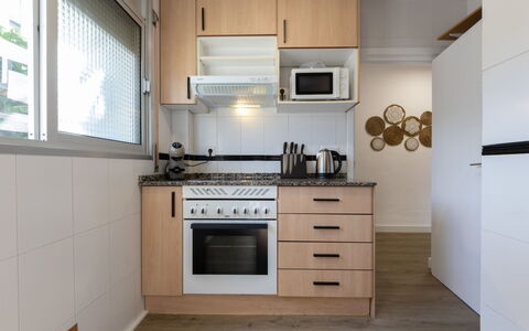Rosa Dels Vents: Kitchen, Kitchen Appliance, Countertop, Furniture, Cabinetry, Major Appliance, Interior Design, Wood, Flooring, Home Appliance