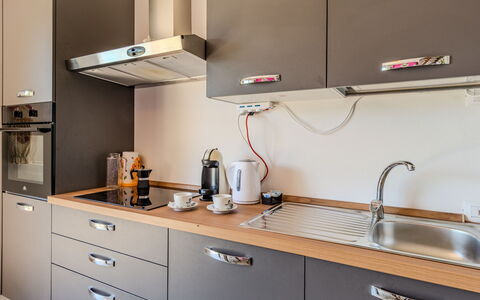 Melissa: Kitchen, Kitchen Appliance, Countertop, Cabinetry, Major Appliance, Interior Design, Home Appliance, Furniture, Wood, Kitchen Sink