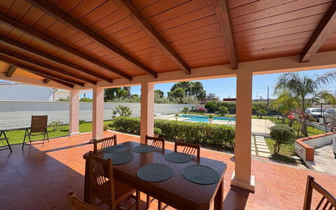 Villa Gloria: Flooring, Wood, Floor, Furniture, Wood Stain, Shade, Resort, Ceiling, Outdoor Structure, Porch