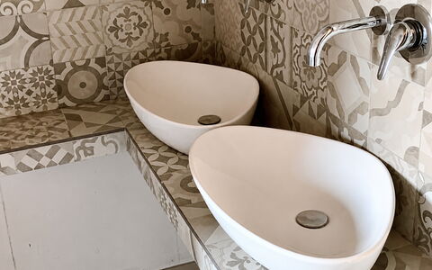 Villa Gloria: Flooring, Bathroom Sink, Plumbing Fixture, Interior Design, Bathroom, Floor, Sink, Tile, Plumbing, Porcelain
