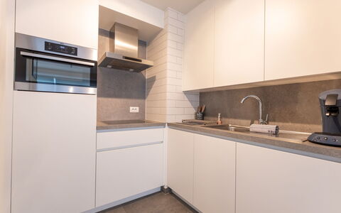 Cosy @ Sea with Terrace: Kitchen, Countertop, Interior Design, Flooring, Kitchen Appliance, Wood, Cabinetry, Major Appliance, Ceiling, Floor