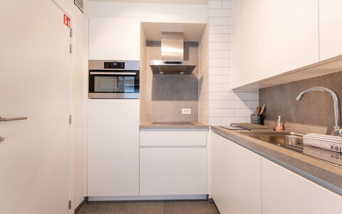 Cosy @ Sea with Terrace: Kitchen, Countertop, Interior Design, Flooring, Kitchen Appliance, Wood, Major Appliance, Floor, Cabinetry, Ceiling