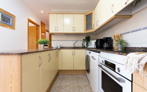 Lisa: Kitchen, Flooring, Interior Design, Countertop, Kitchen Appliance, Furniture, Wood, Cabinetry, Major Appliance, Floor