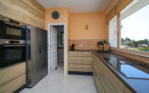 Castillo: Kitchen, Cabinetry, Interior Design, Furniture, Countertop, Flooring, Kitchen Appliance, Floor, Major Appliance, Wood