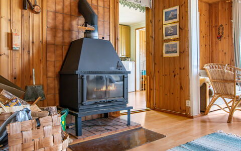 Merenkurkku: Wood, Furniture, Interior Design, Ceiling, Room, Hardwood, Living Room, Chair, Light Fixture, Log Cabin