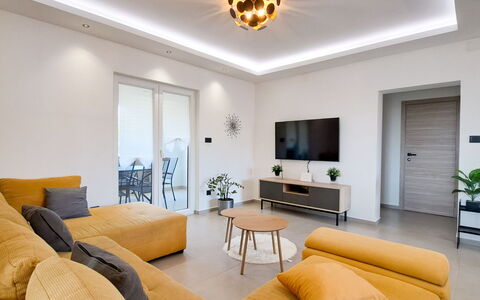 Nona: Furniture, Interior Design, Flooring, Floor, Couch, Wall, Wood, Ceiling, Living Room, Room