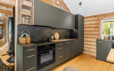 Villa Praava a: Flooring, Wood, Kitchen, Furniture, Interior Design, Countertop, Cabinetry, Floor, Wood Flooring, Kitchen Appliance