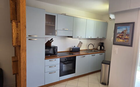 Villa Norma: Kitchen Appliance, Kitchen, Countertop, Major Appliance, Cabinetry, Flooring, Kitchen Sink, Furniture, Wood, Home Appliance