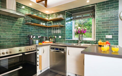 Leetor: Kitchen, Flooring, Countertop, Interior Design, Kitchen Appliance, Floor, Major Appliance, Tile, Cabinetry, Furniture