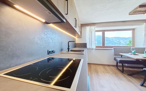 Ferienhaus Dinkl: Interior Design, Flooring, Ceiling, Kitchen, Countertop, Light Fixture, Lighting, Room, Floor, Home