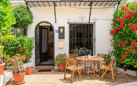 Carmen: Flowerpot, Door, Houseplant, Furniture, Balcony, Outdoor Furniture, Chair, Outdoor Table, Porch